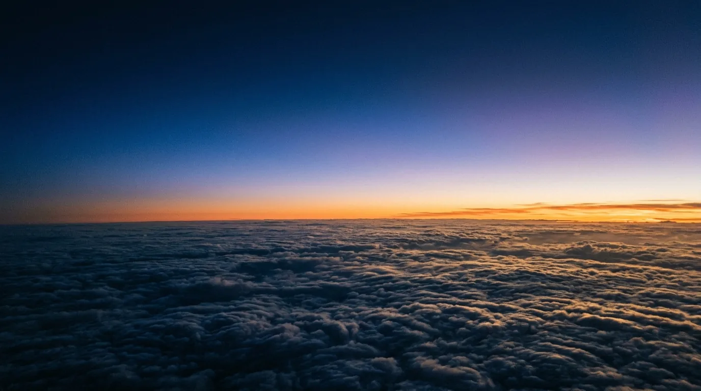 First light striking a sea of clouds from above